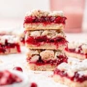 close up of stack of cranberry crumble bars.