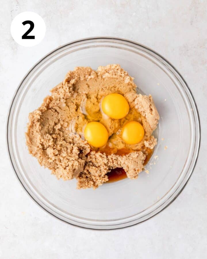 adding eggs to batter.