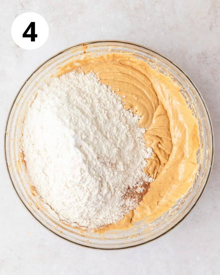 adding dry ingredients to gingerbread batter.
