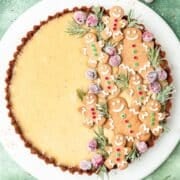 close up of eggnog custard tart topped with gingerbread cookies.