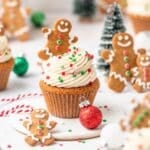 close up of gingerbread cupcakes topped with mini gingerbread men.