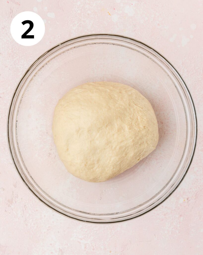 letting dough rise in greased bowl.
