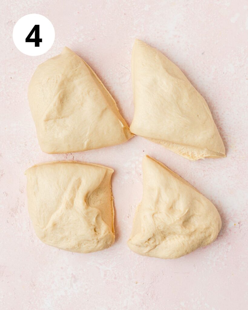 star bread dough cut into 4 equal pieces.