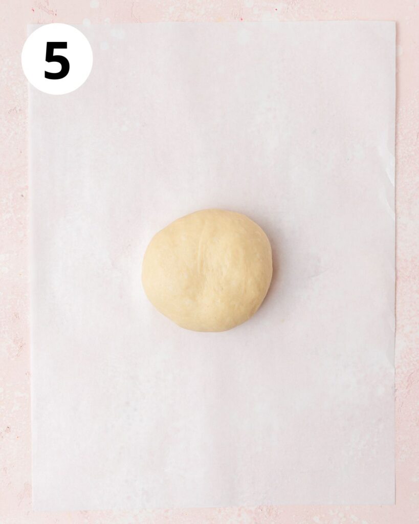 first ball of dough on parchment sheet.