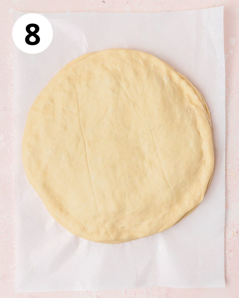 layering the other circles of dough and cranberry sauce.
