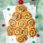 close up of christmas tree shaped spinach artichoke rolls.