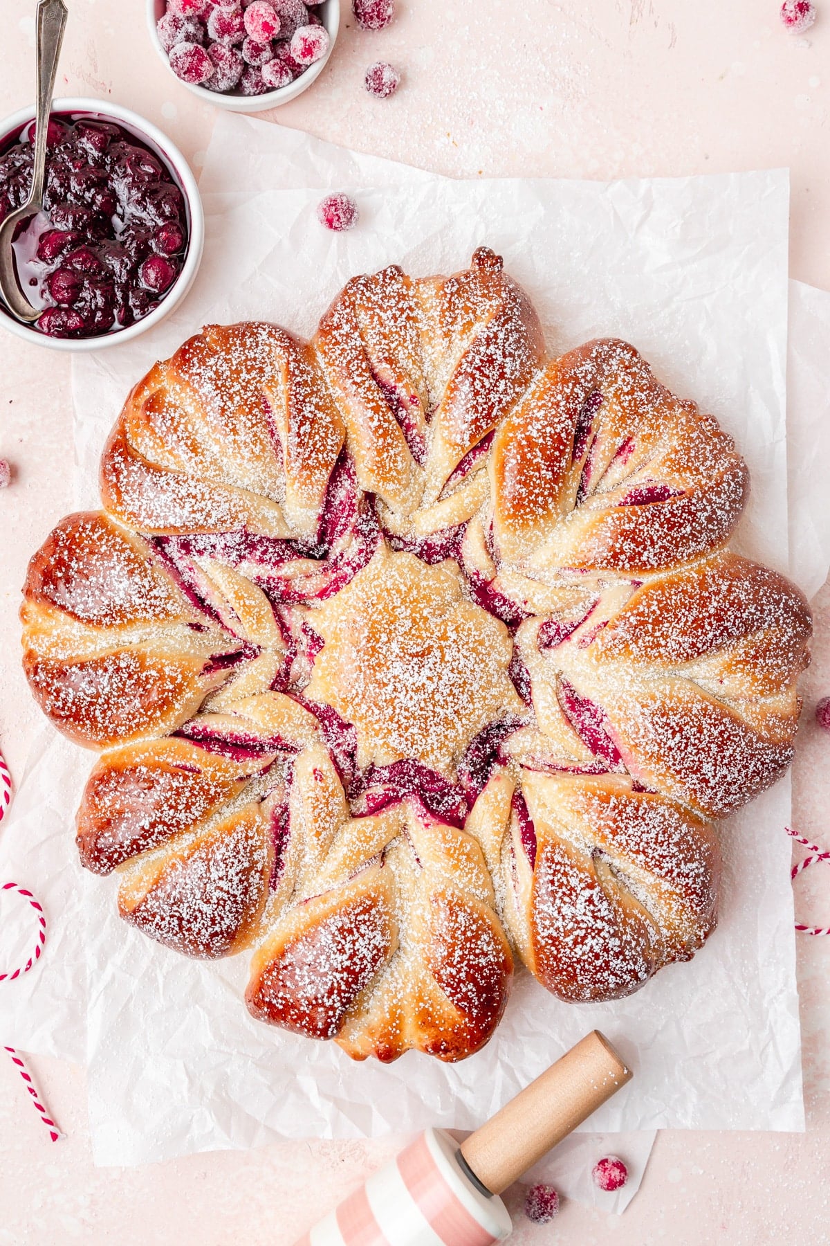 cranberry star bread with powdered sugar on top.