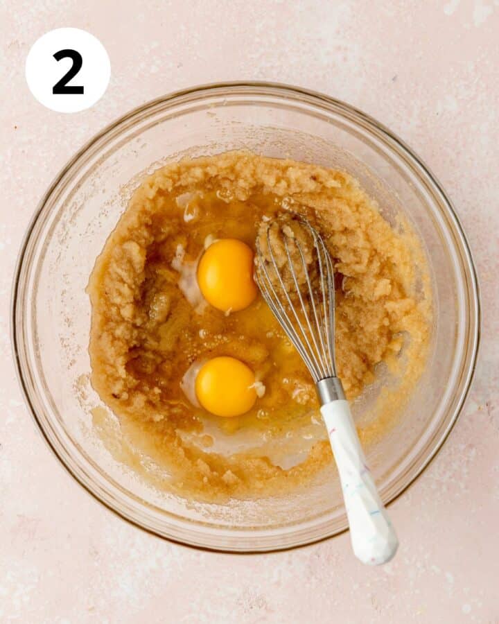 adding eggs to cake batter.