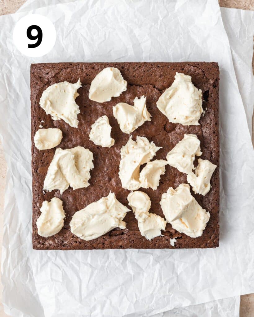 dollops of irish cream frosting on brownies.