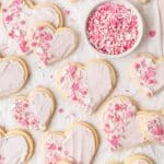 close up of frosted sugar cookies shaped like hearts.