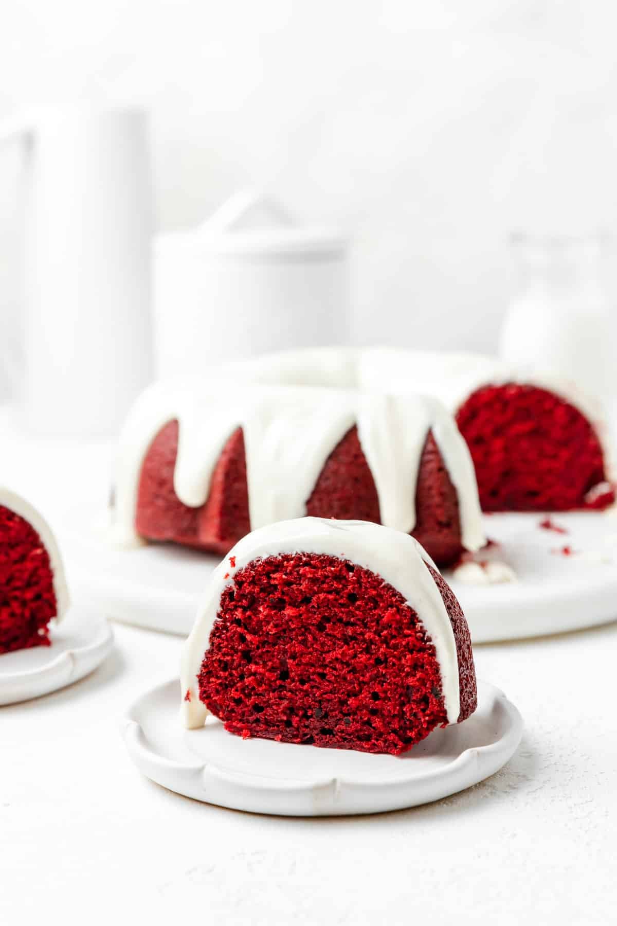 slice of red velvet bundt cake with cream cheese frosting.
