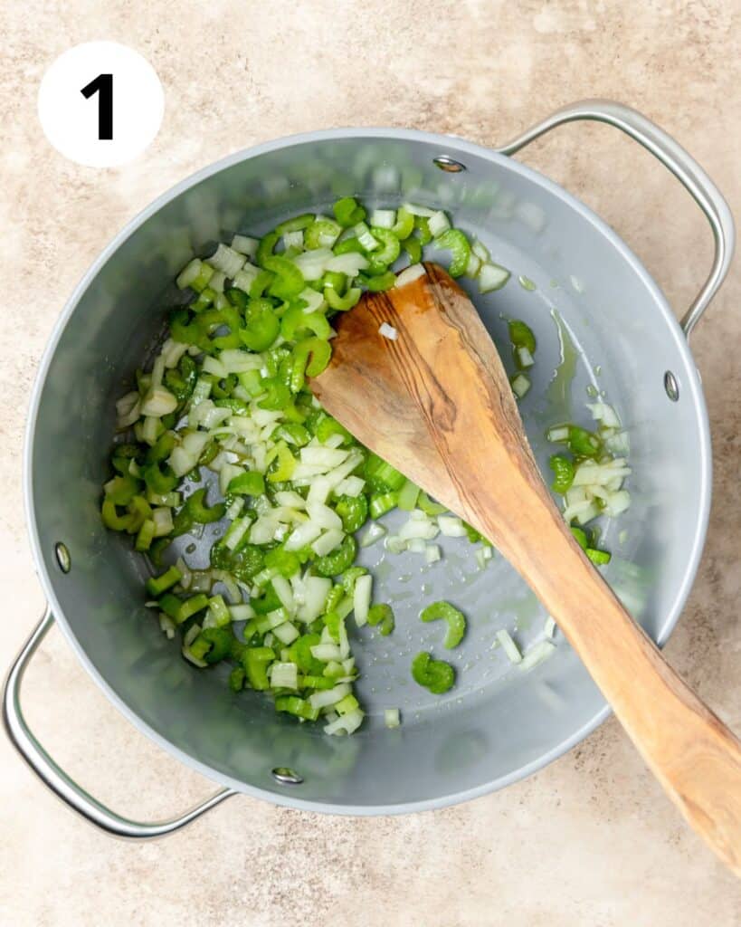 sautéing celery and onion in pot.