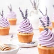 close up of honey lavender cupcakes with lavender flowers.