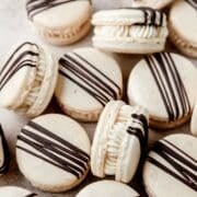 close up of Bailey's Irish cream macarons with chocolate drizzle.