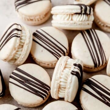 close up of Bailey's Irish cream macarons with chocolate drizzle.