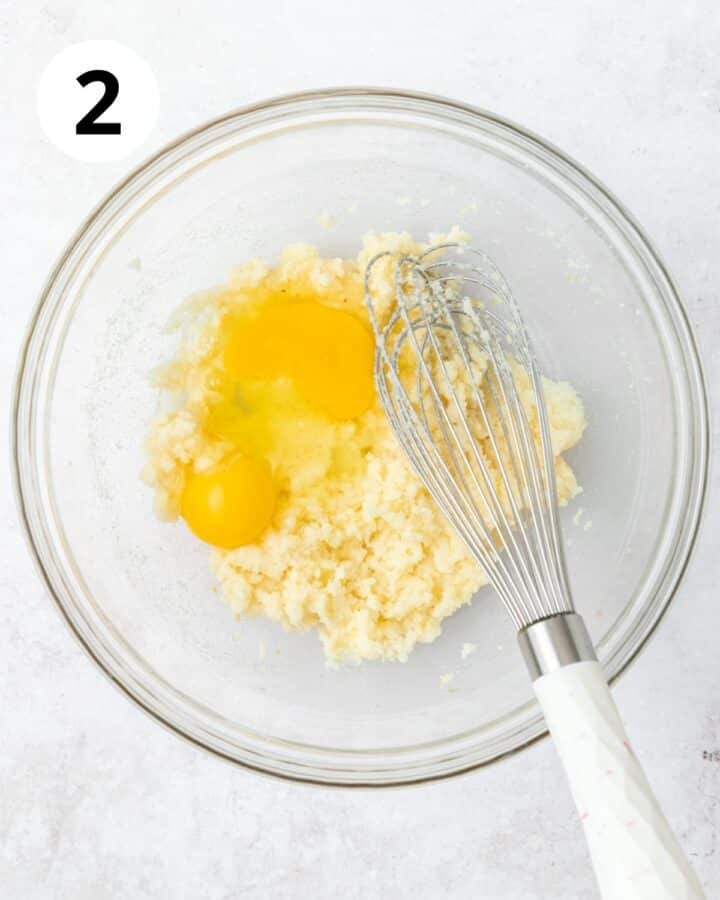 adding eggs to lemon batter. 