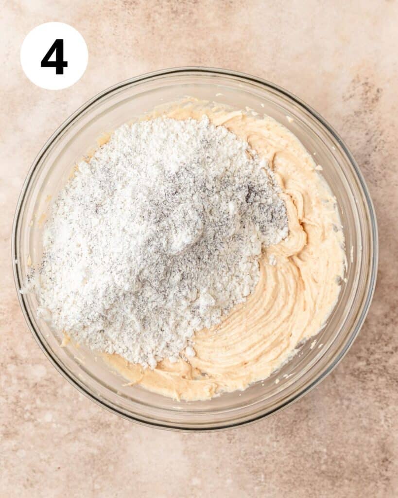 adding flour and espresso powder to cookie dough.