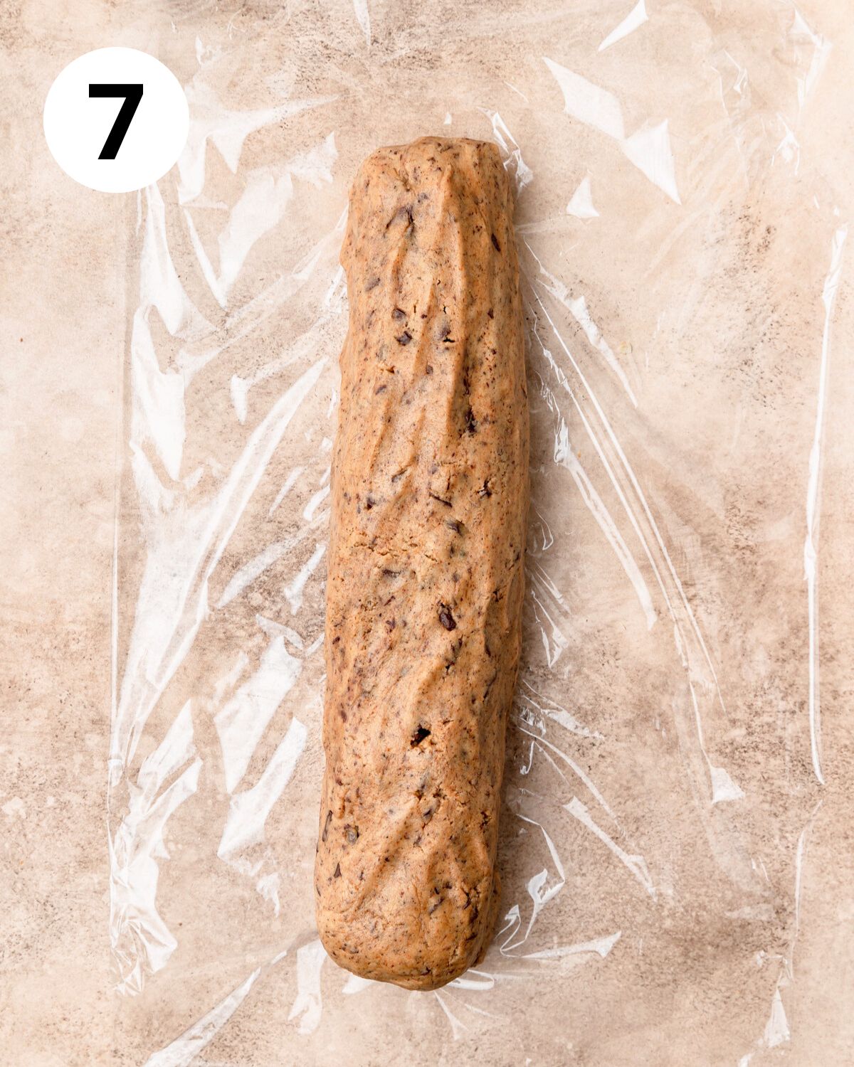 log of cookie dough wrapped in plastic.