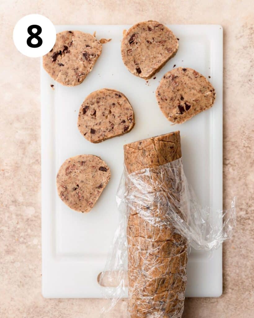 slicing chocolate chunk cookie dough.