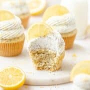 close up of lemon poppy seed cupcakes with cream cheese frosting.