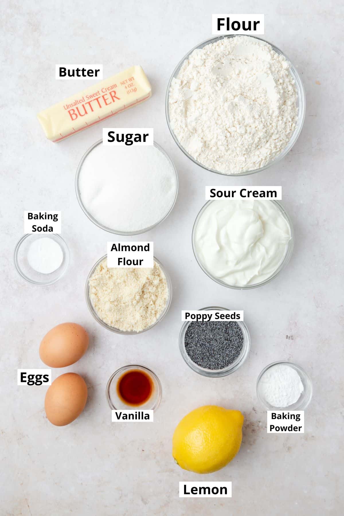 labeled ingredients for lemon poppy seed muffins.