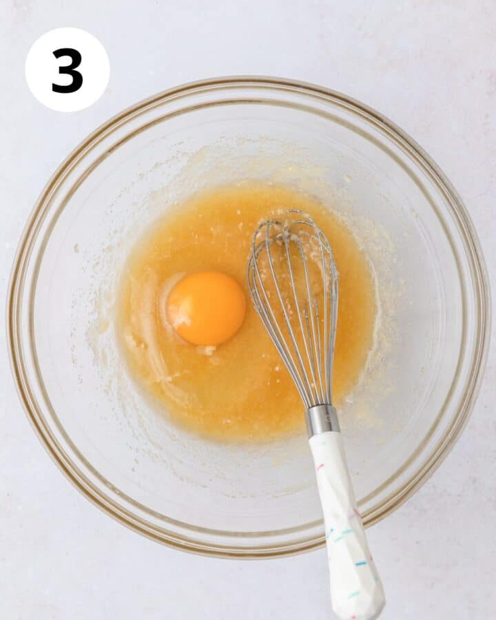 adding egg to batter.