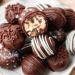 close up of chocolate covered cookie dough bites.