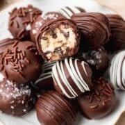 close up of chocolate covered cookie dough bites.