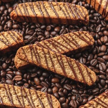 close up of espresso biscotti drizzled with dark chocolate.