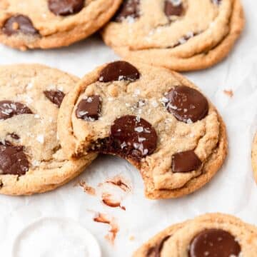 close up of tahini chocolate chip cookies with bite taken out.