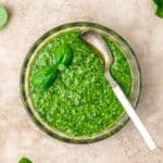 close up of bowl of fresh basil pesto.