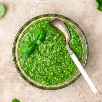 close up of bowl of fresh basil pesto.