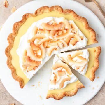 close up of coconut cream pie topped with toasted coconut.