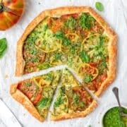 close up of heirloom tomato galette with pesto and goat cheese.