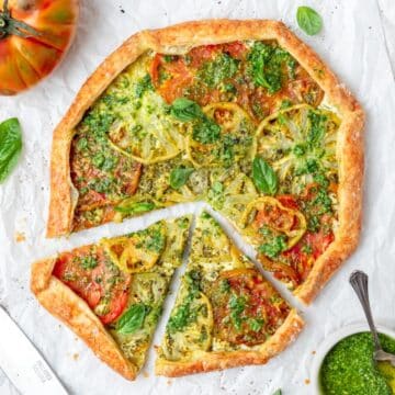 close up of heirloom tomato galette with pesto and goat cheese.