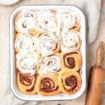 close up of sourdough cinnamon rolls with cream cheese glaze.