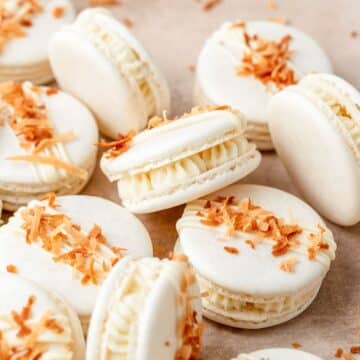 close up of toasted coconut macarons with white chocolate.