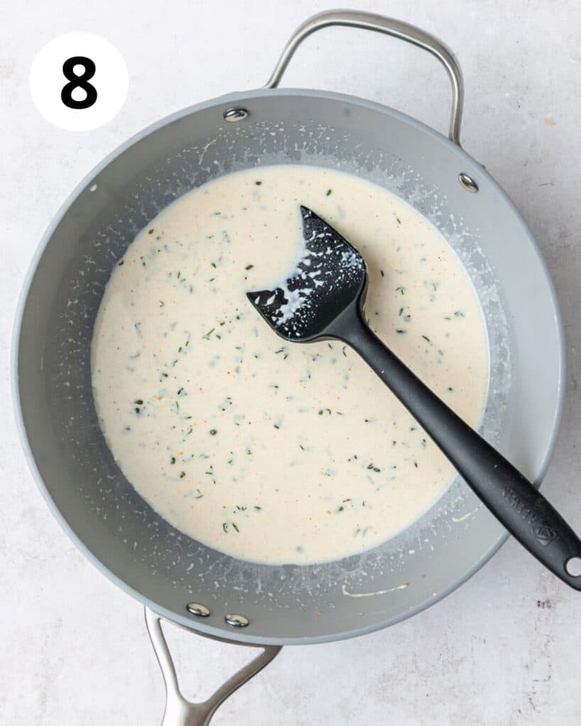 adding milk to sauce.
