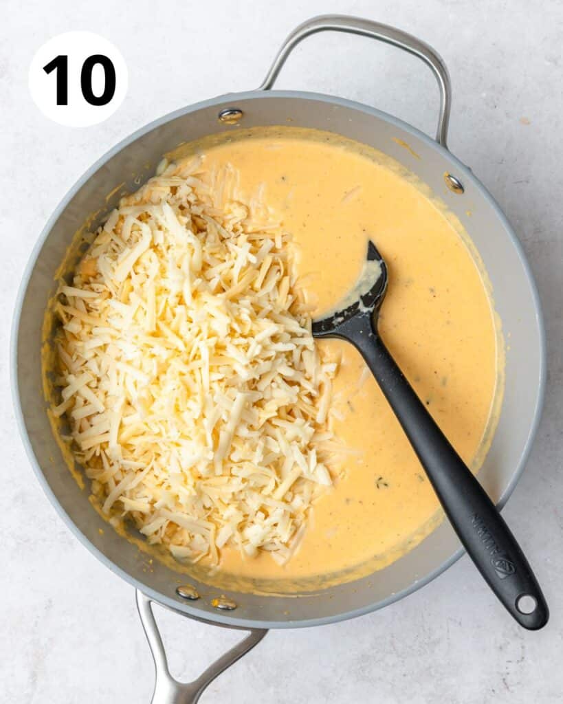 adding cheese to sauce.