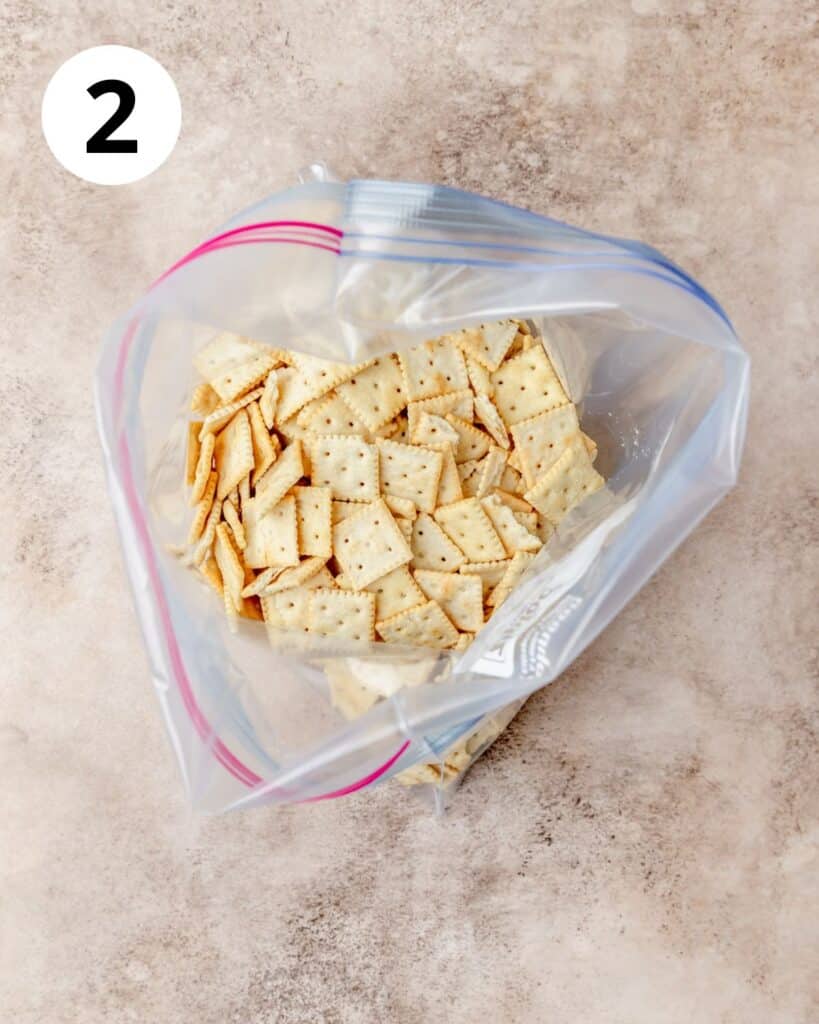 adding mini saltines to bag.