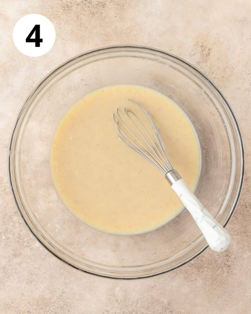 adding milk to cornbread batter.