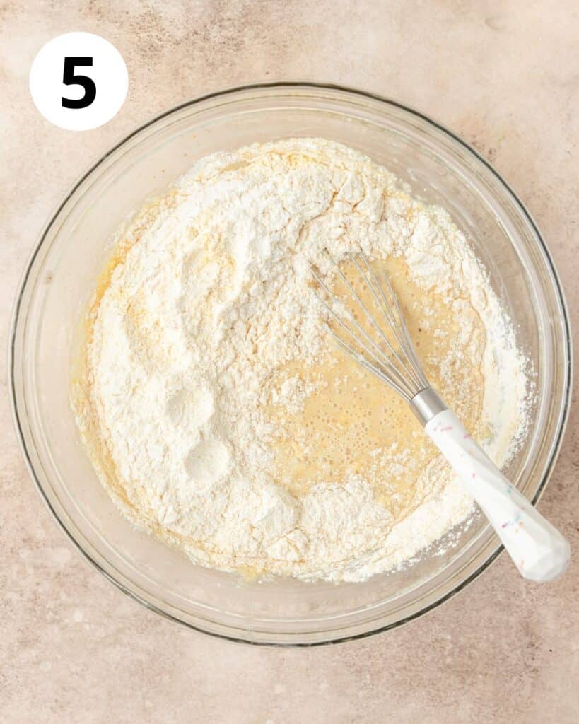 adding dry ingredients to cornbread batter.