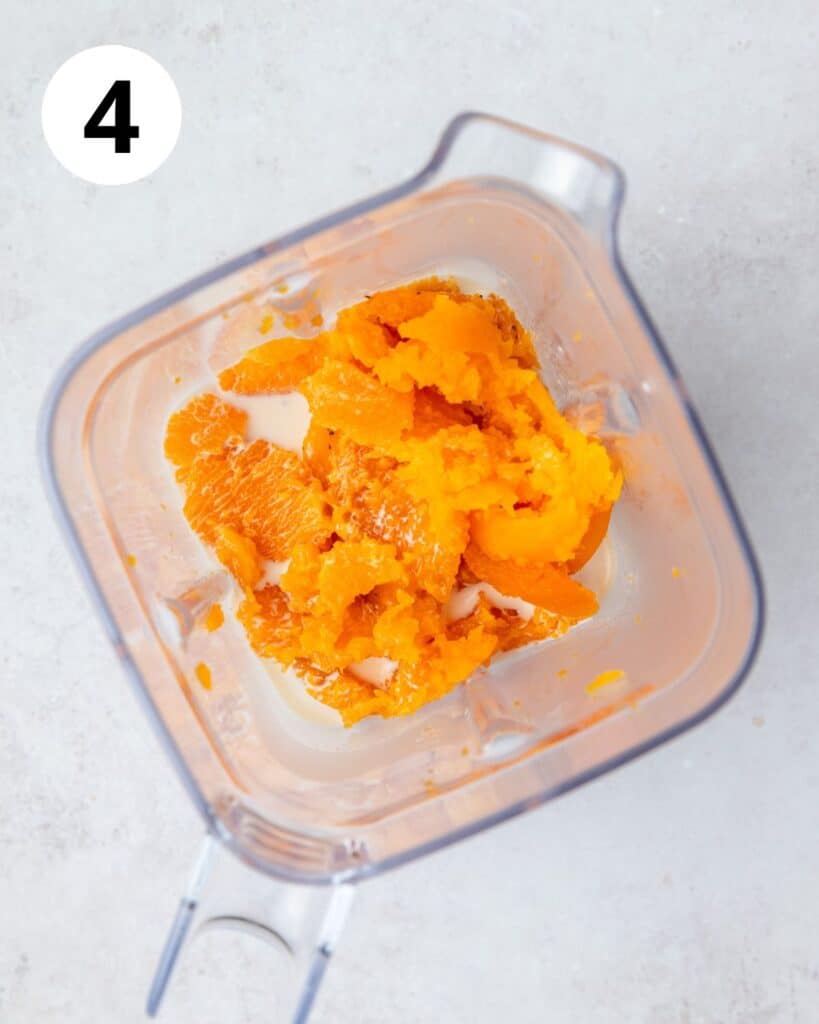 roasted butternut squash and milk in blender.