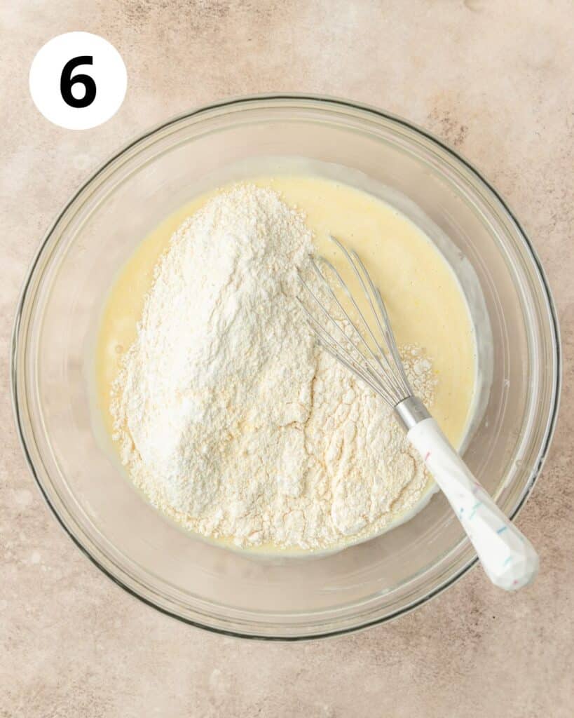 adding dry ingredients to cornbread batter.