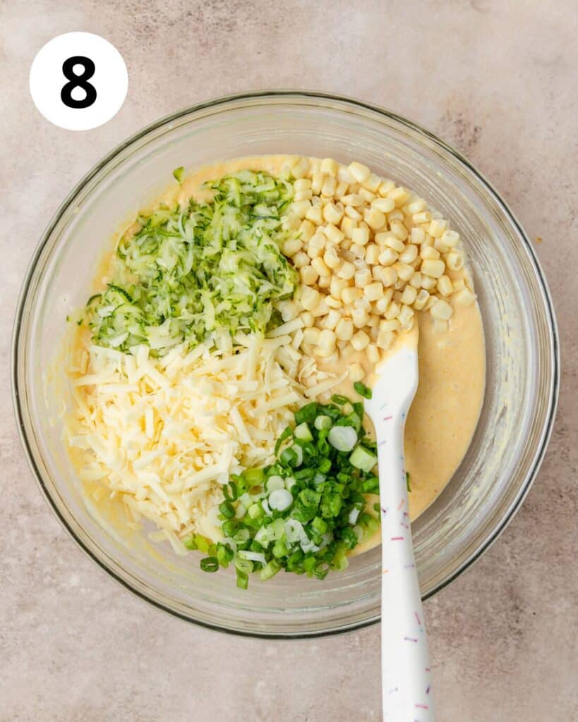 adding zucchini, corn, and cheese to batter.