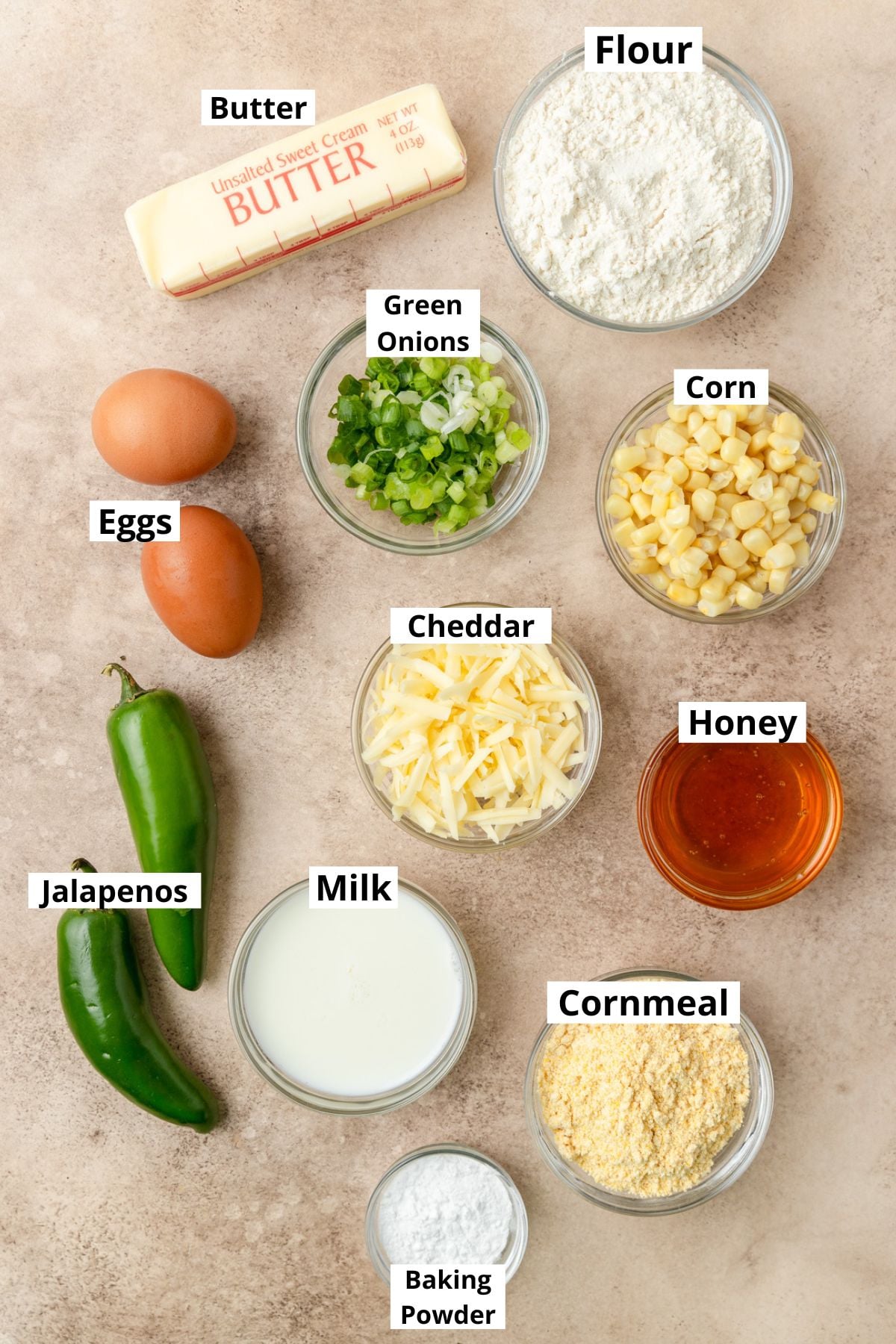 labeled ingredients for jalapeno cheddar cornbread muffins.