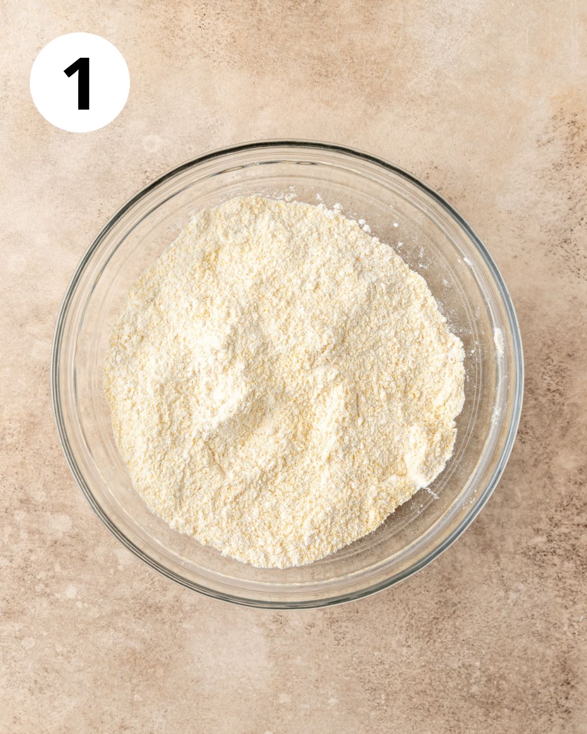whisking together dry ingredients for cornbread.