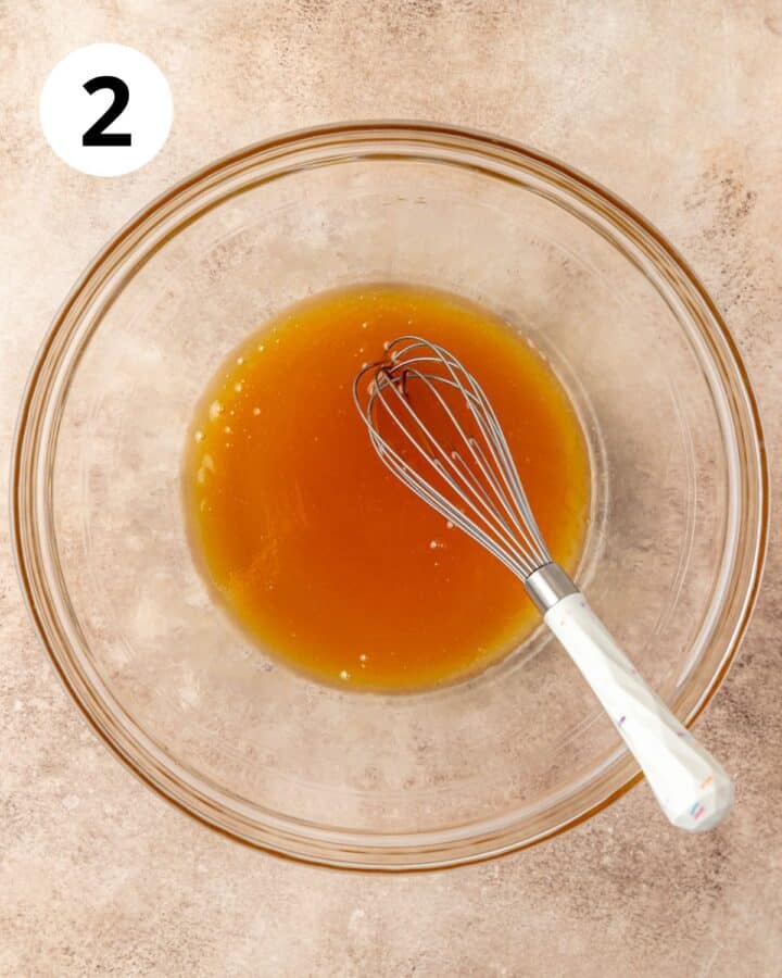 whisking together butter and honey.