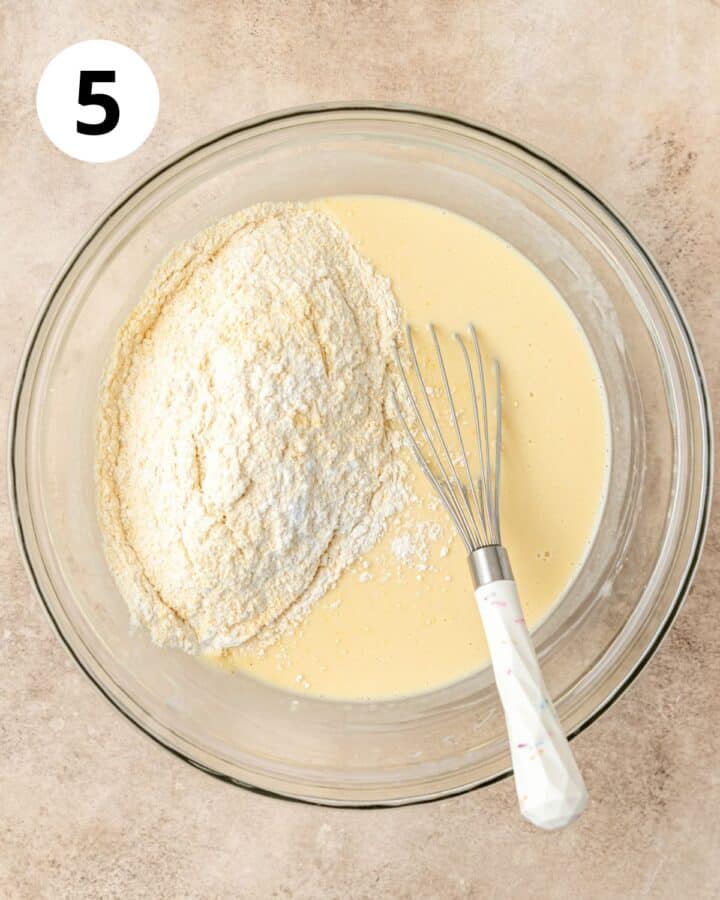 adding dry ingredients to cornbread batter.