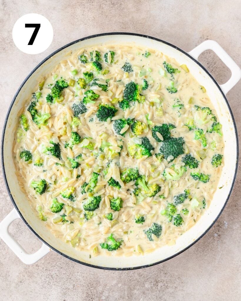 broccoli cheddar orzo in skillet.